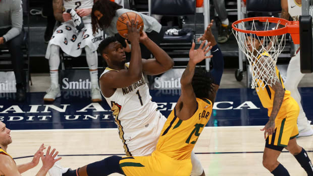 Jan 19, 2021; Salt Lake City, Utah, USA; New Orleans Pelicans forward Zion Williamson (1) shoots the ball over Utah Jazz center Derrick Favors (15) during the first quarter at Vivint Smart Home Arena. Mandatory Credit: Chris Nicoll-USA TODAY Sports
